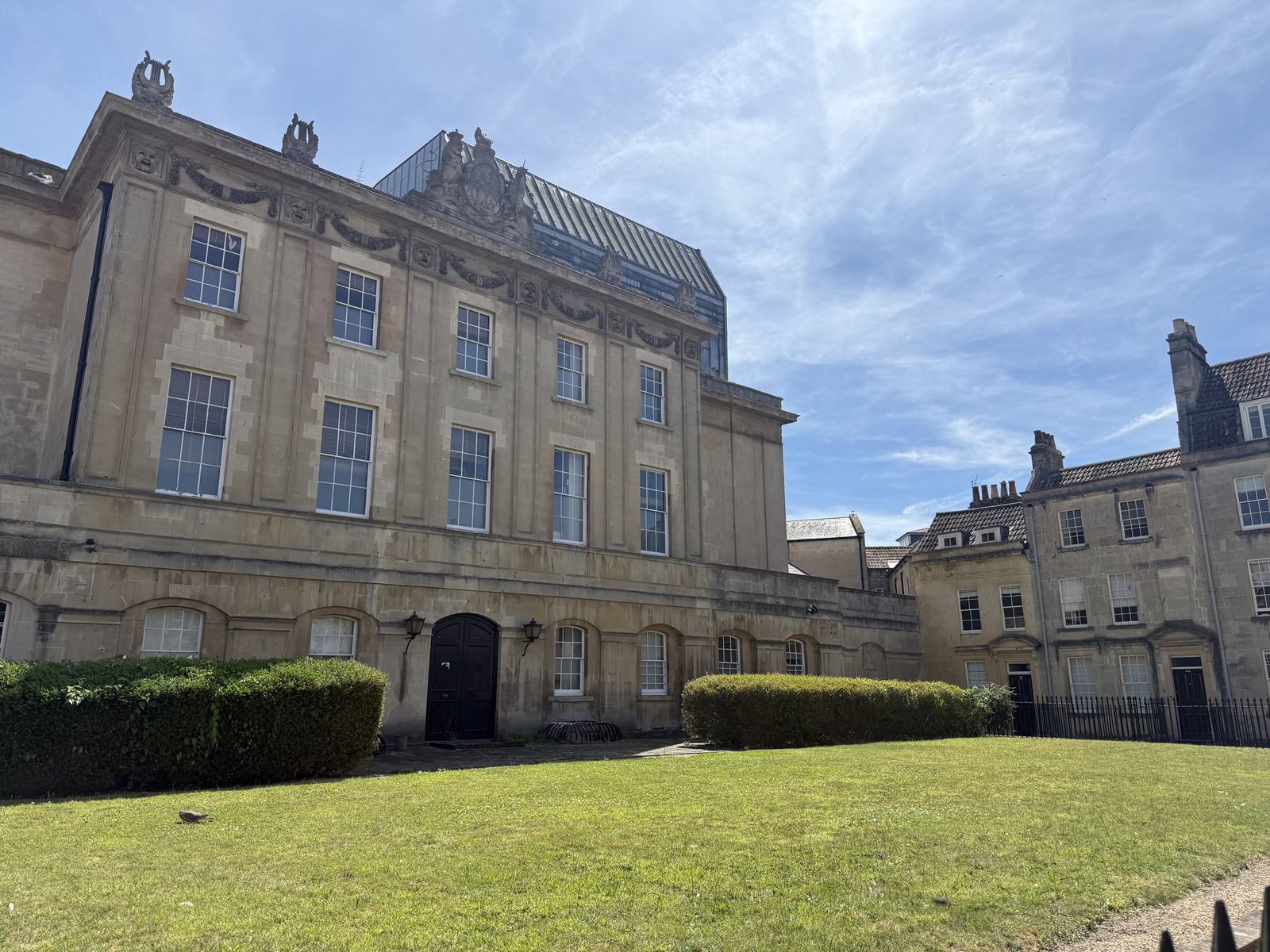 A Georgian stone facade above a lawn in Bath's upper town, the elegant residential streets near the Royal Crescent