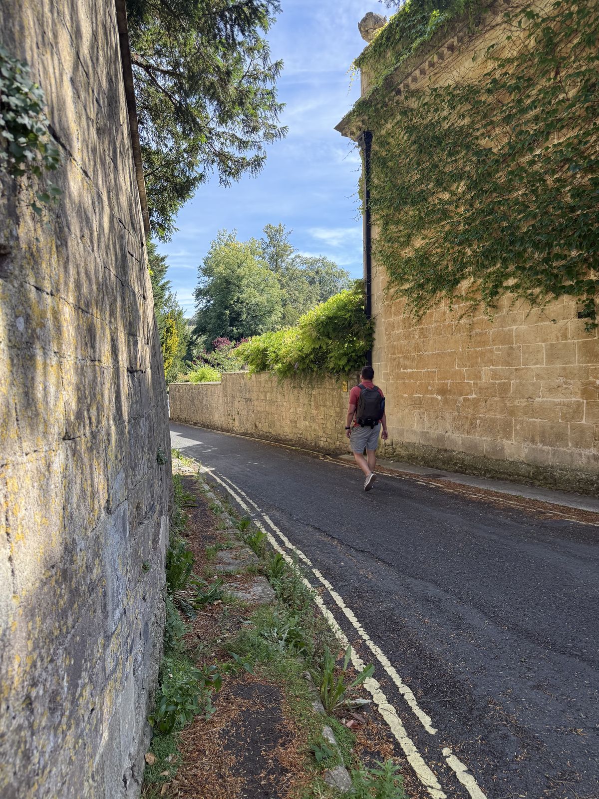 A quiet stone-walled lane in central Bath, the kind of narrow street where hotels rarely have their own parking