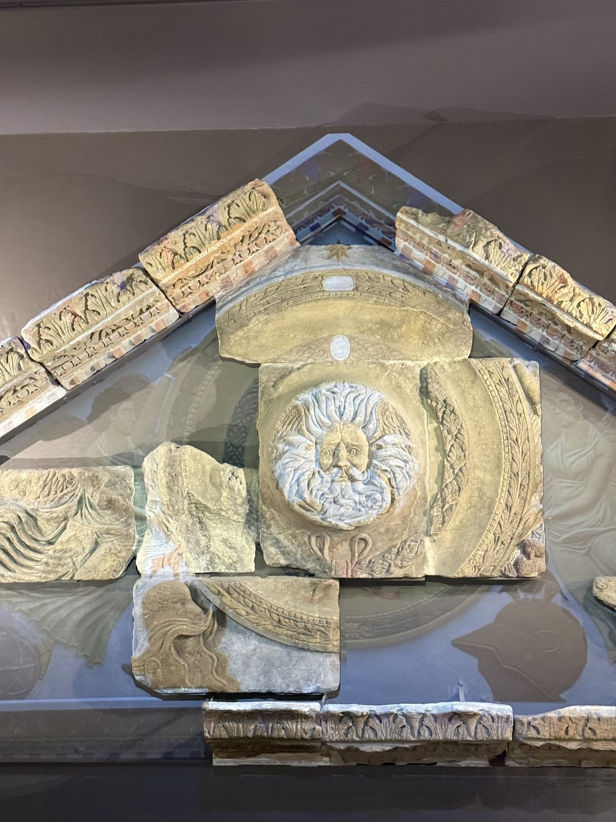 The carved Gorgon's head from the Temple pediment at the Roman Baths